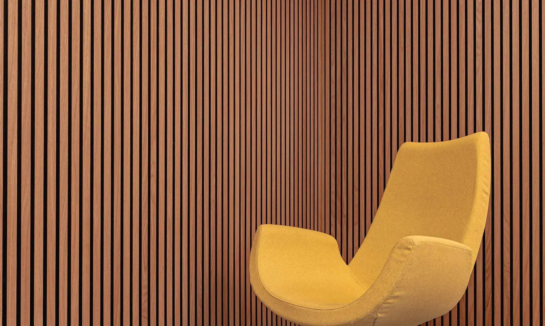 A slatted acoustic wall panel in an interior