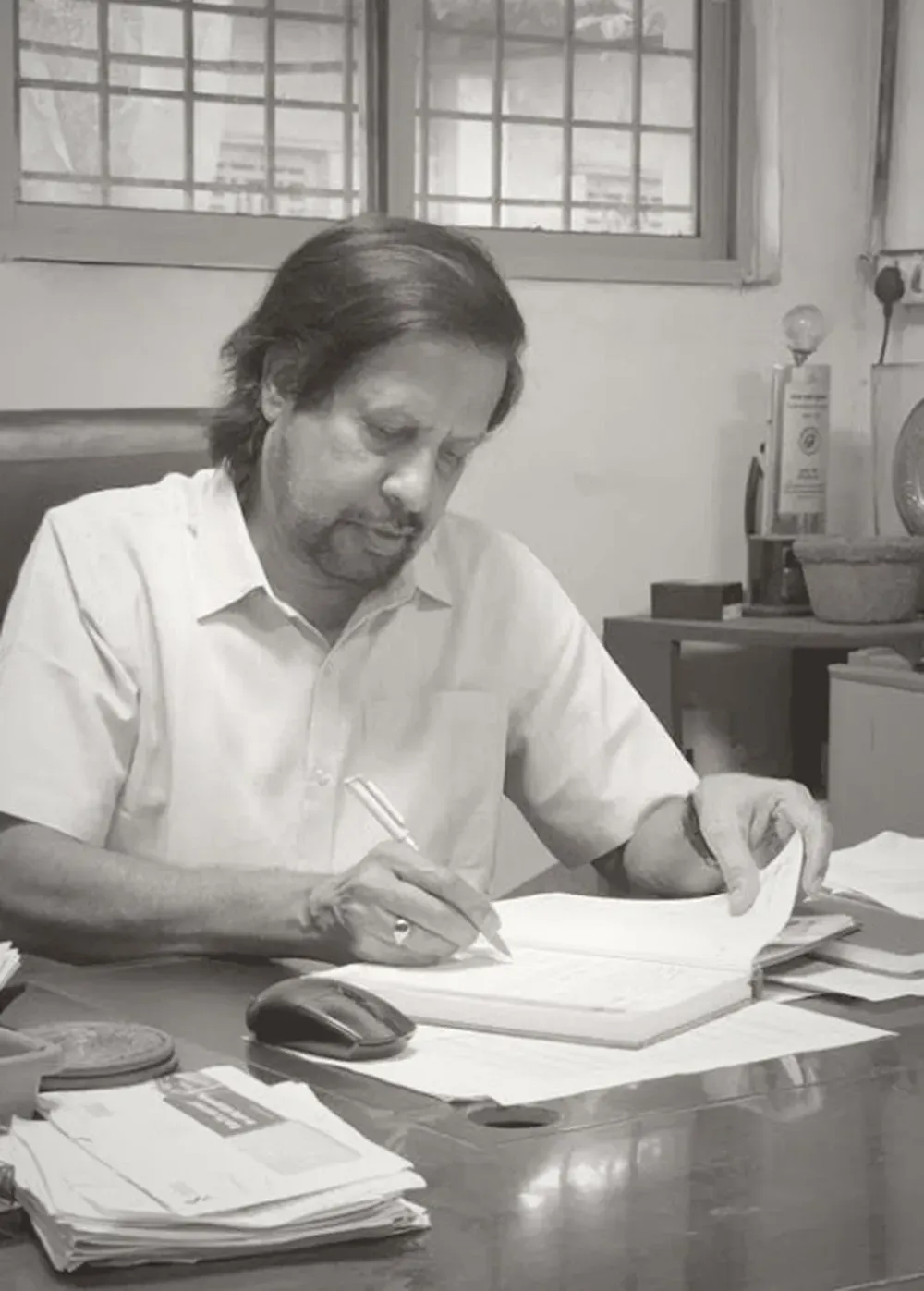 A founder of 2M Engineers at his desk
