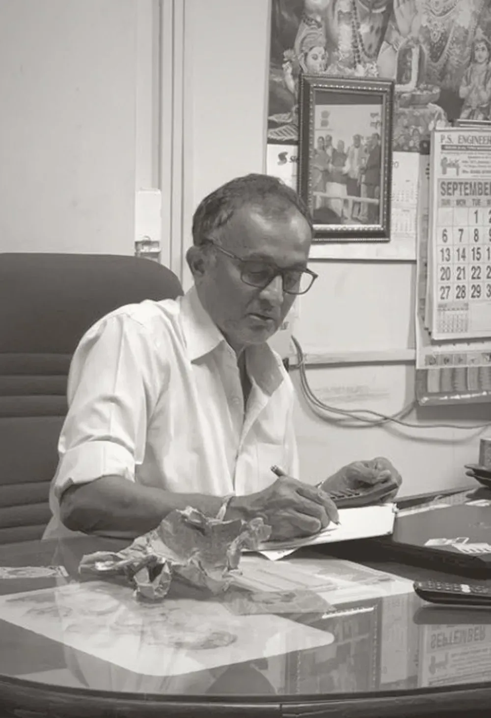 A founder of 2M Engineers at his desk